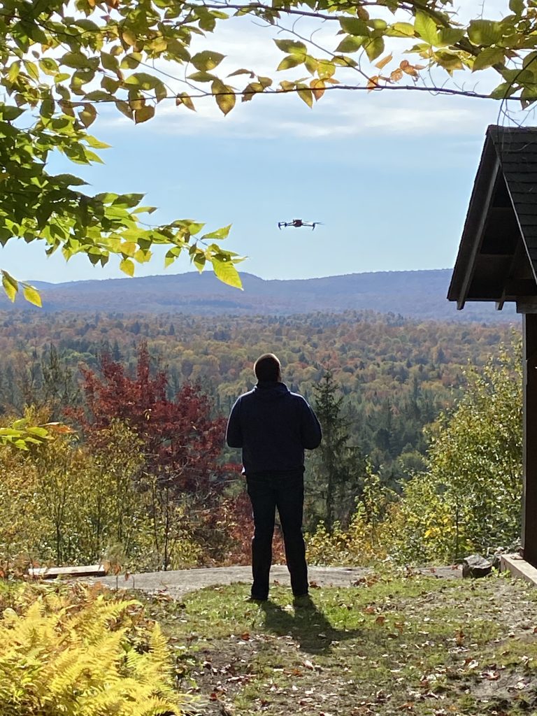 aiden mcguire of aiden media flying a drone in the adirondacks